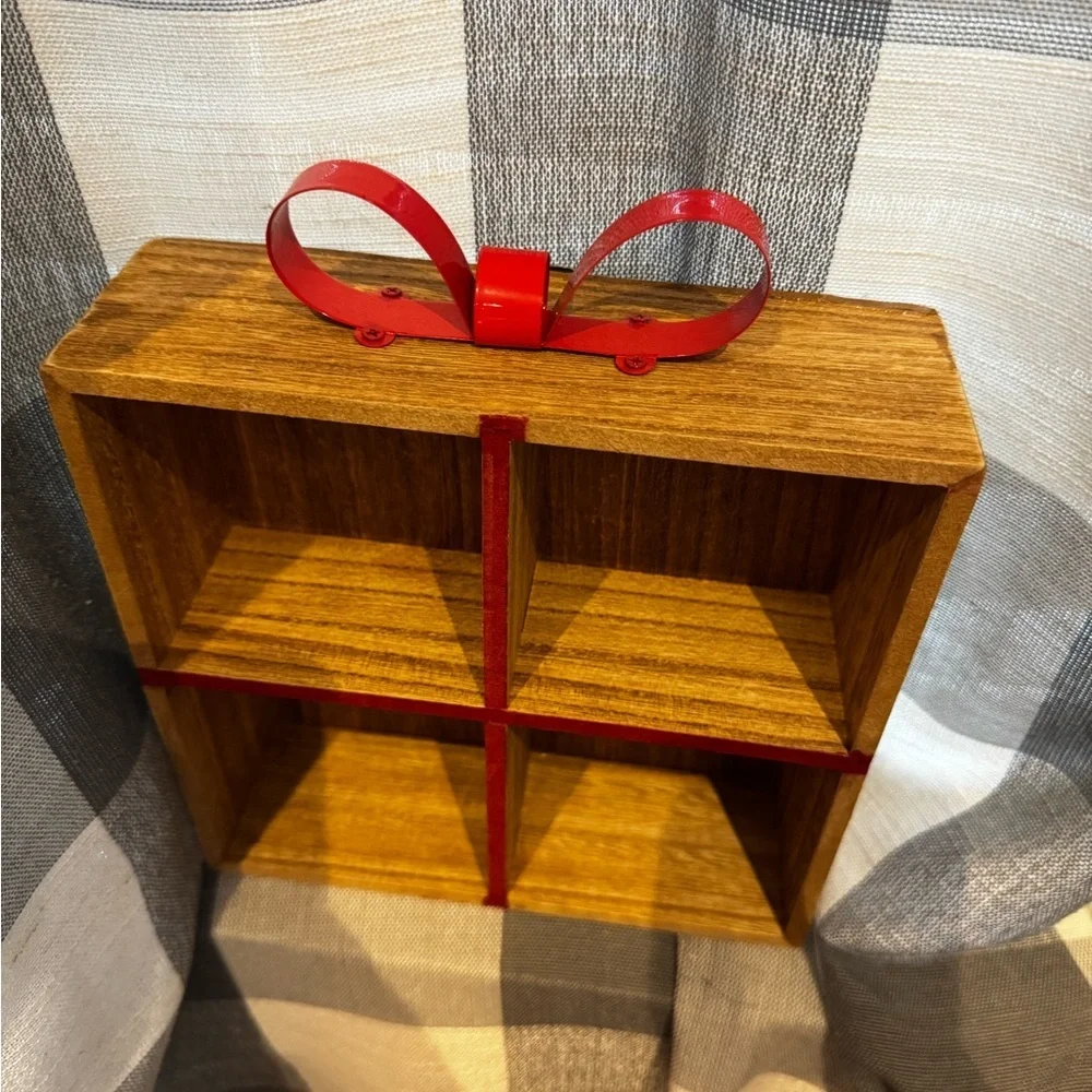 Elegant Brown Wooden Wall Shelf with Red Accents